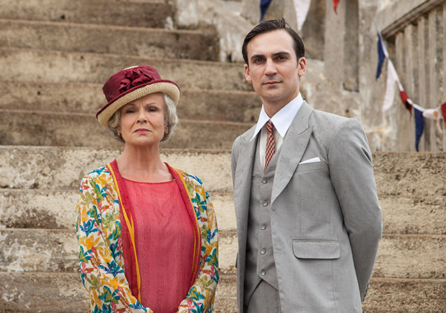 Left to right: Julie Walters as Cynthia Coffin and Henry Lloyd-Hughes as Ralph Whelan. ((C) New Pictures and Channel 4 for MASTERPIECE in association with All3Media International) 
