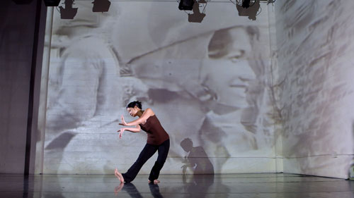 Burt incorporates video imagery into her more contemporary work. Here she rehearses "Silenced," which honors Cambodian pop icon Ros Sereysothea. Burt will perform the piece in San Francisco at CounterPULSE in March.