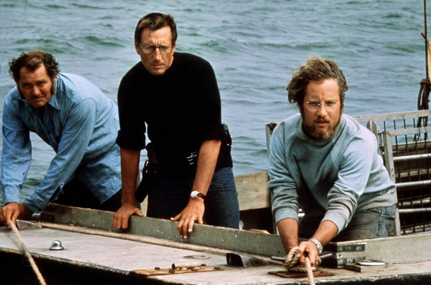 Robert Shaw (from left), Roy Scheider and Richard Dreyfuss play a shark hunter, a police chief and a marine biologist in 1975's <em>Jaws</em>.