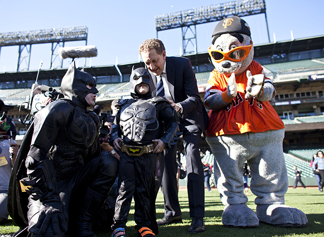 Leukemia survivor Miles, 5, dressed as BatKid, and Batman release the San Francisco Giants mascot from the Penguin as part of a Make-A-Wish foundation fulfillment at AT&T Park November 15, 2013 in San Francisco.  (Photo by Ramin Talaie/Getty Images)
