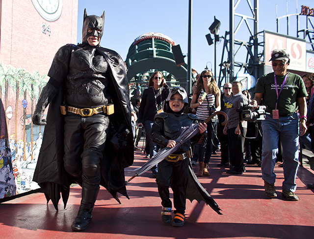 Leukemia survivor Miles, 5, dressed as BatKid, and Batman release the San Francisco Giants mascot from the Penguin as part of a Make-A-Wish foundation fulfillment at AT&T Park November 15, 2013 in San Francisco.   (Photo by Ramin Talaie/Getty Images)