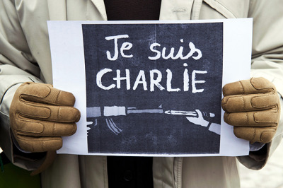 A journalist holds a placard reading in French" I am Charlie" during a gathering on the streets of Pristina on January 8, 2015 in solidarity with the victims of the shooting at the Paris office of the satirical newspaper Charlie Hebdo which left 12 people dead. ARMEND NIMANI/AFP/Getty Images)