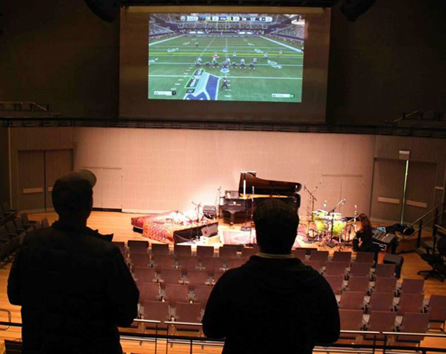 Eric Harland and friend test-drive the video-game setup at SFJAZZ's Miner Auditorium. (Photo: Ross Eustis)