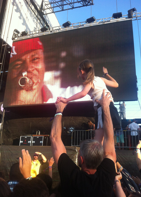 A young girl on her dad's shoulders watching L.L. Cool J at BottleRock 2014