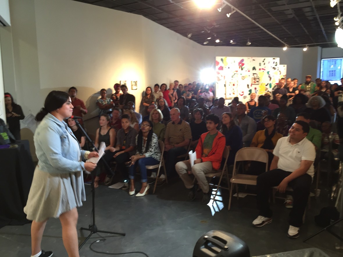 16 year old Litzy Castillo, a student at MetWest High School, thrills the crowd with her poem