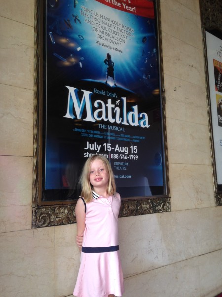 Rowan Kelly stands in front of a poster for 'Matilda the Musical' at the Orpheum Theatre in San Francisco 