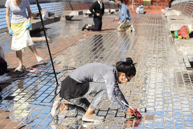 The artist and volunteers laying out <i>Sky Bridge</i>, 2015. (Photo: Lydia Han/CCC)