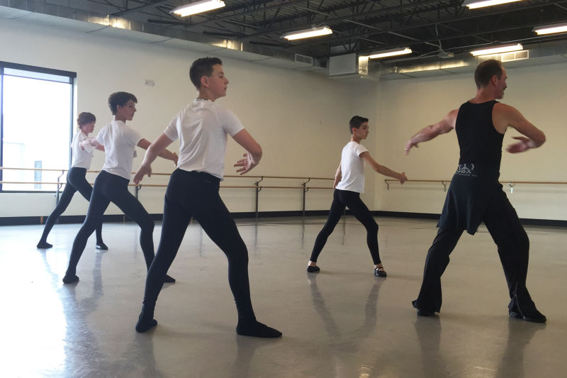 Ballet master John Gardner (right) leads an all-boys class at the Colorado Ballet in Denver.