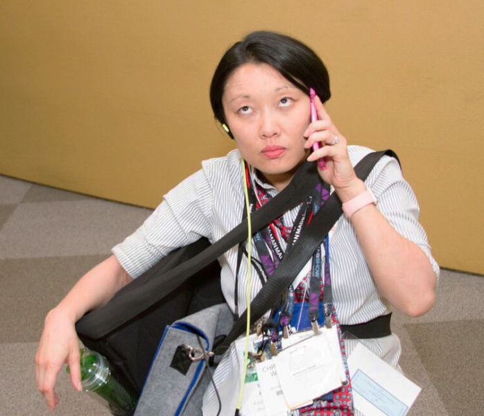 Christina White taking a business call between Dreamforce panels