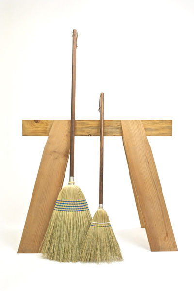 Adult and kid-sized brooms by Hannah Quinn.