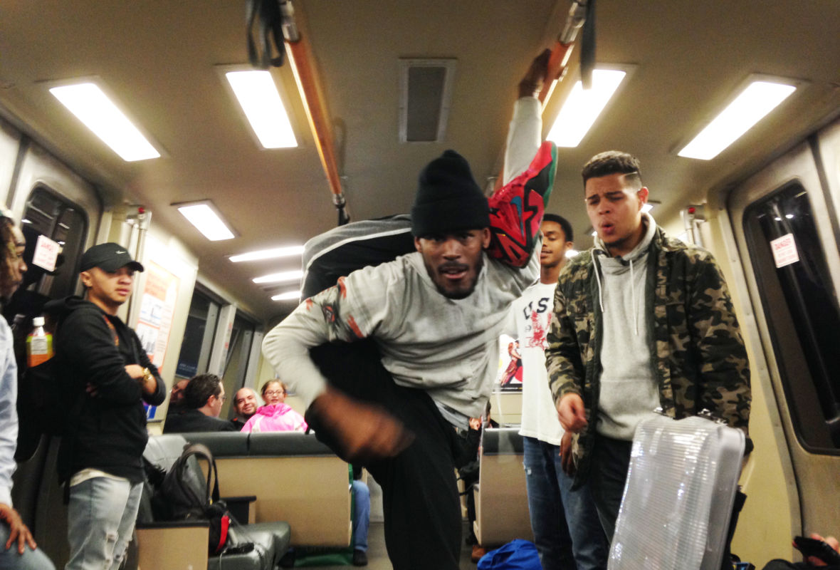 "Krow" the dancer shows his moves on a BART train