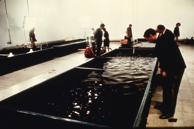 People exploring the Harrisons' "Portable Fish Farm" installation in 1971