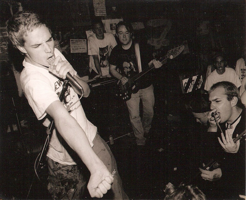 Jesse Townley (at left), fronting the band Blatz at 924 Gilman in the early 1990s.