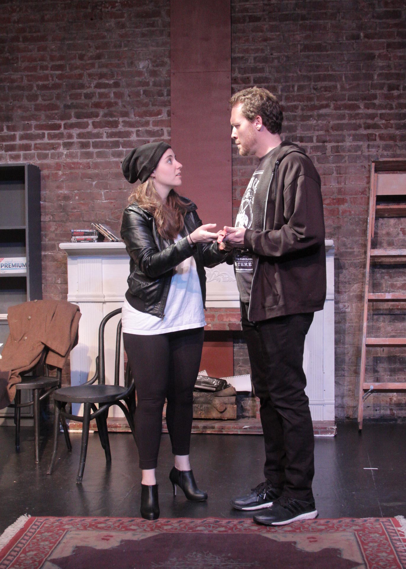 Julia Mulholland as Musetta prepares to sells her Apple Watch with William O’Neill as Marcello in Opera on Tap’s production of La Bohème.