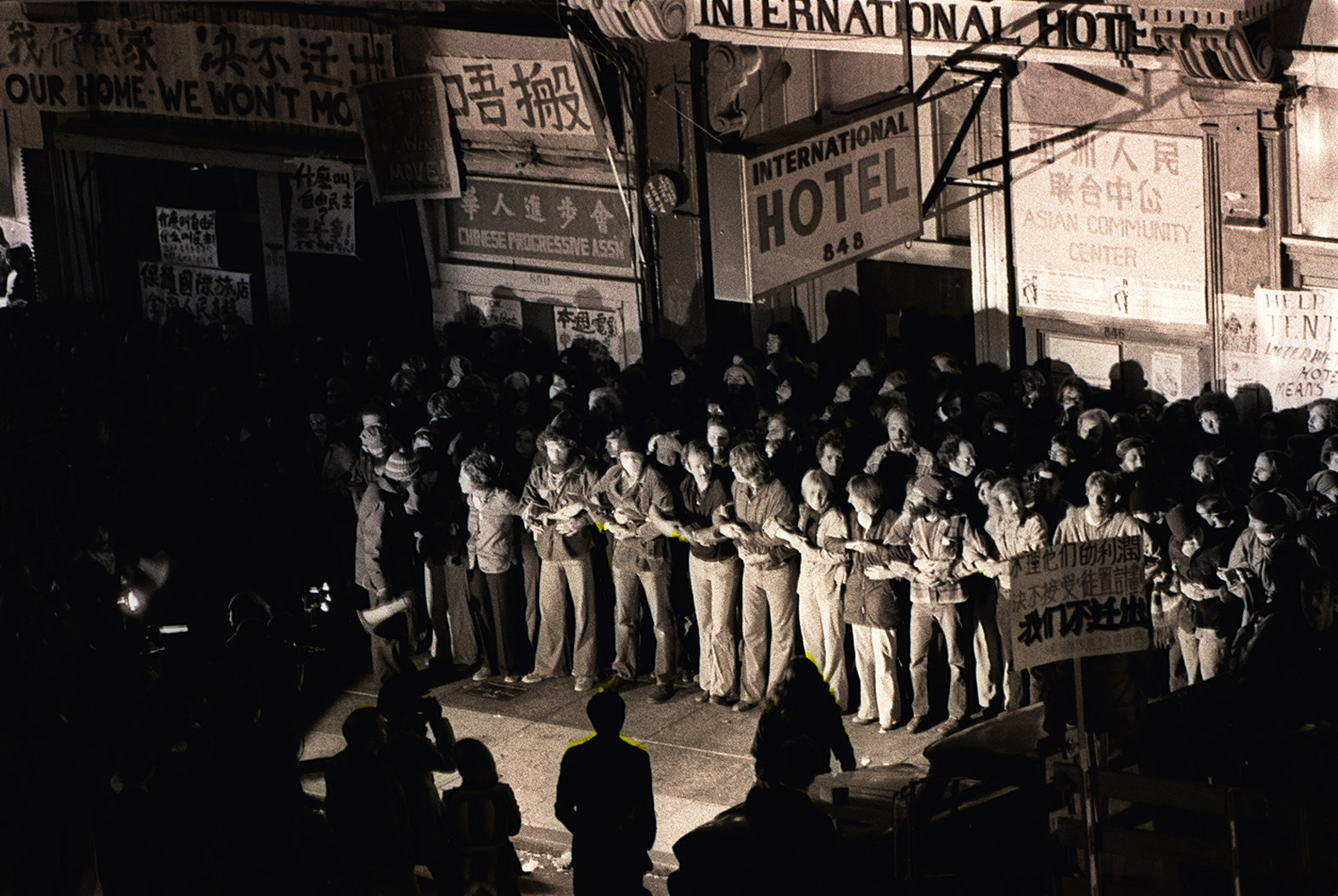 Hundreds of protesters linking arms in front of the International Hotel in San Francisco try to prevent the San Francisco Sheriffs' deputies from evicting elderly tenants on August 4,1977. 