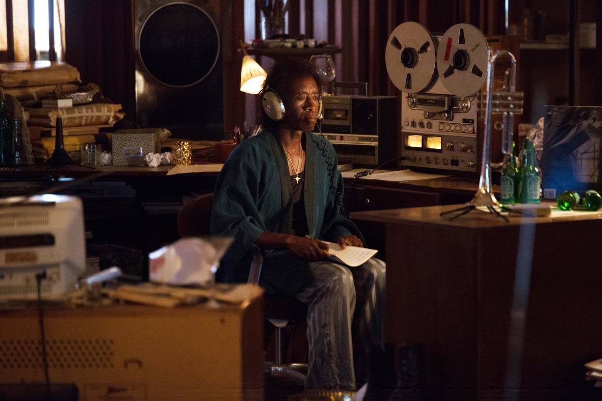 Don Cheadle as Miles Davis, listening to reel-to-reel tapes and trying to regain his muse, from 'Miles Ahead.'
