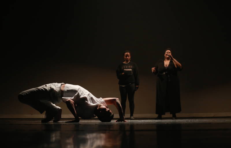 George Cheng (on the floor) with singers Rashida Chase and Valerie Troutt in Nicole Klaymoon's ‘Chalk Outlines’