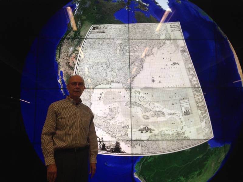 David Rumsey stands in front of a map from 1733 superimposed over Google Earth. Wouldn't you like to run a search for viewing on a 16 x 9' computer screen?