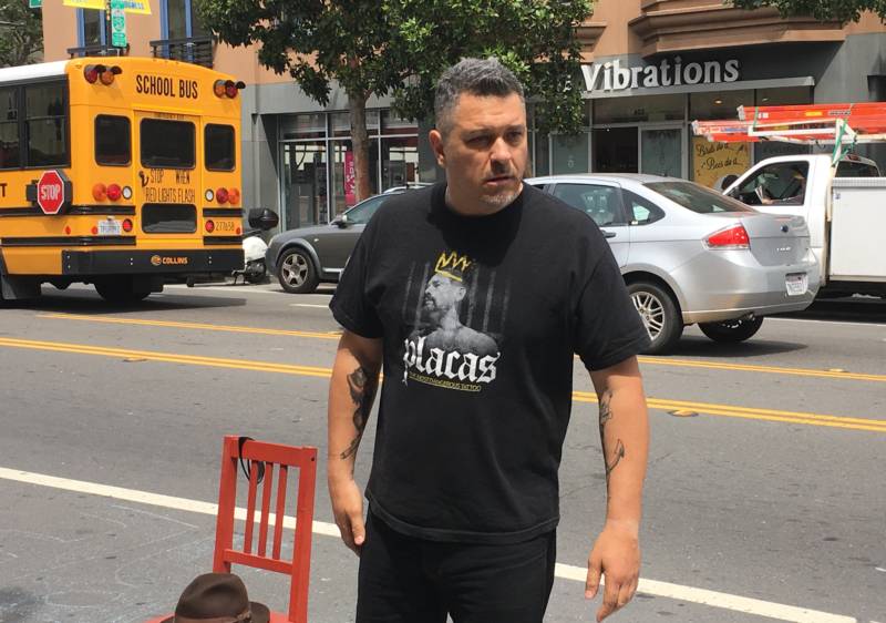 Actor Paul Flores performs his solo show, 'You're Gonna Cry' outside the Mission police station on Wednesday, May 4 in solidarity with the Frisco Five hunger strikers