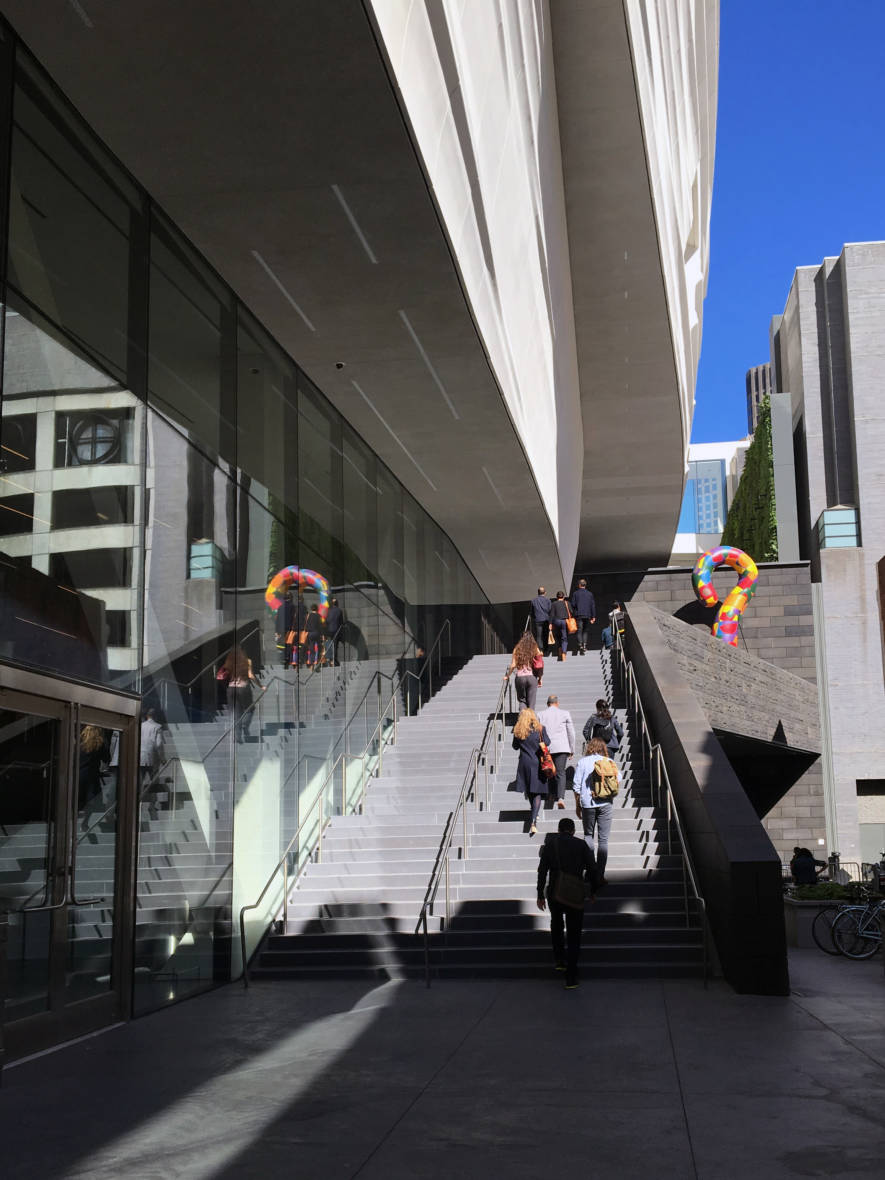 People walk up to the entrance to the new SFMOMA.