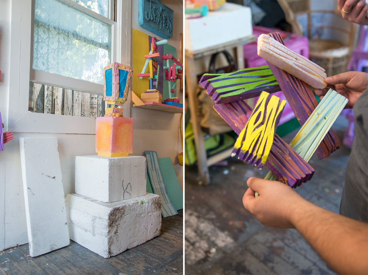 A stack of materials and a painted foam sculpture repurposed from previous works.