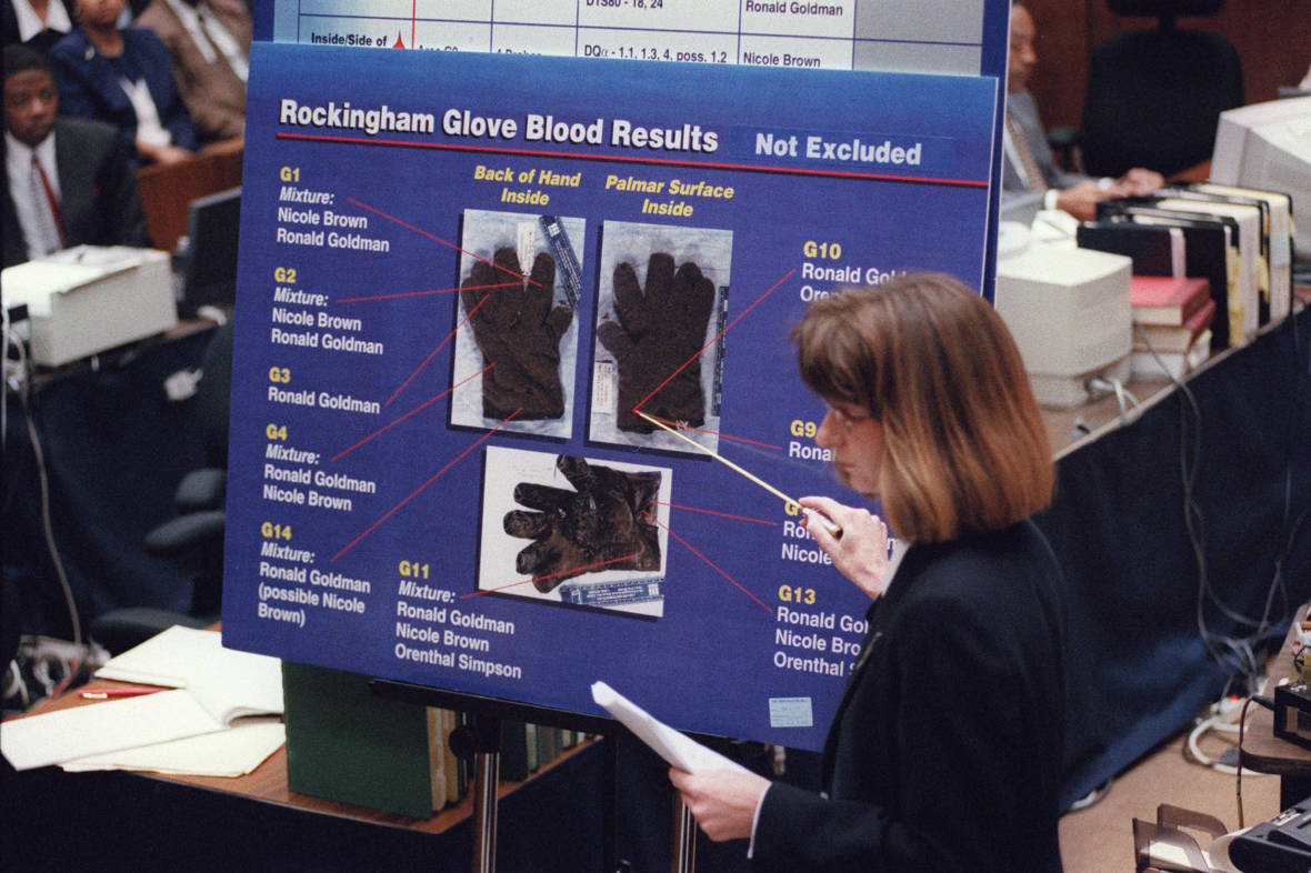 California Department Of Justice criminalist Renee Montgomery points to blood spots found on the leather glove at O. J. Simpson's Rockingham estate during redirect examination in the O.J. Simpson double-murder criminal trial on May 24, 1995, in Los Angeles.