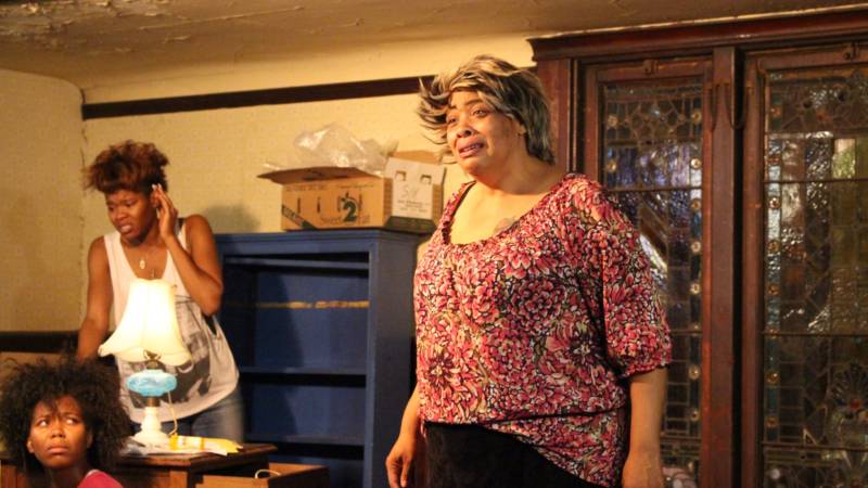 (L to R) Cookie (Chaz Shermil) watches as her mother Crank (Jasmine Hughes) and great-grandmother Big Mama (Kimba Daniels) implode in Ubunta Theater Projects' 'Hurt Village.'