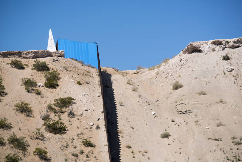 U.S. Mexico Border fence is seen from Ciudad Juárez, Mexico after artist Ana Teresa Fernandez and Border/Arte volunteers painted the border fence in blue to give an illusion of "Erasing the Border" on Saturday, April 9, 2016.