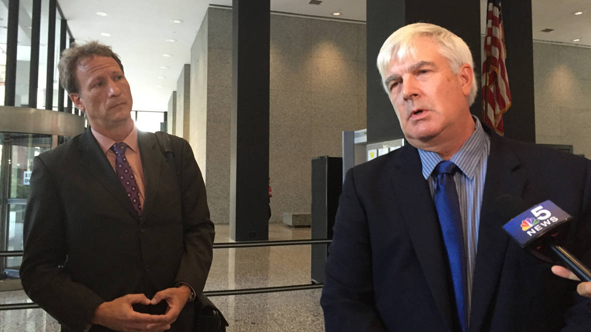 Attorney William Zieske (left) and his client Robert Fletcher (right) speak to reporters at the US federal courthouse in Chicago on August 23, 2016, after losing their lawsuit against artist Peter Doig.  They accused him of falsely denying authorship of a painting.  