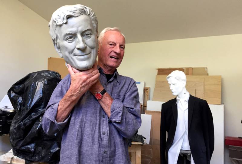 Sculptor Bruce Wolfe poses with the plaster cast of Tony Bennett's head. To Wolfe's right is a model for a bust he's working on of former mayor Gavin Newsom.
