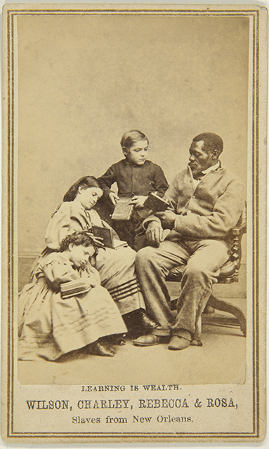 Captioned carte de visite (Learning is Wealth. Wilson, Charley, Rebecca & Rosa, Slaves from New Orleans), c. 1864