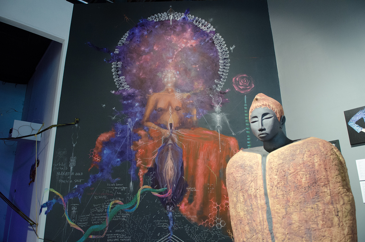 Statue: Amana Brembry Johnson, 'Earth.' Wall: Sage Stargate, 'Ancestral Womb Portal.'