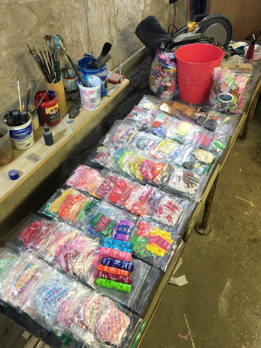 At Brown's studio in Philadelphia, he stores candy wrappers by kind and color in Ziploc bags.