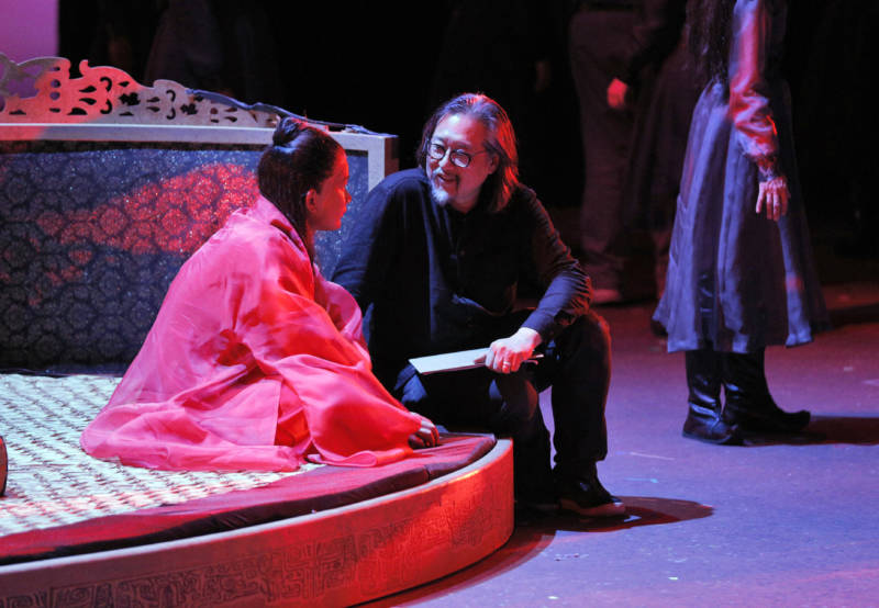 Yiji Shi in costume as Bao Yu with director Stan Lai as they rehearse for world premiere of 'Dream of the Red Chamber' at San Francisco Opera