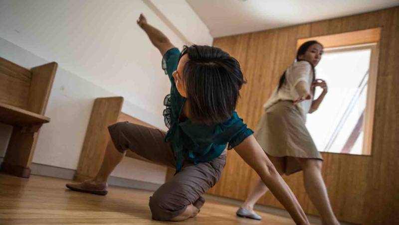 (L to R) SanSan Kwan and Wei-Shan Lai dance from room to room in Lenora Lee's 'The Eye of Compassion' at Cameron House.