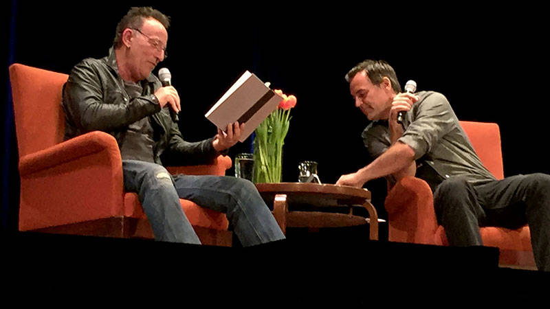 Bruce Springsteen reads from 'Born to Run' with interviewer Dan Stone at a City Arts & Lectures appearance at the Nourse Theater in San Francisco, Oct. 5, 2016.