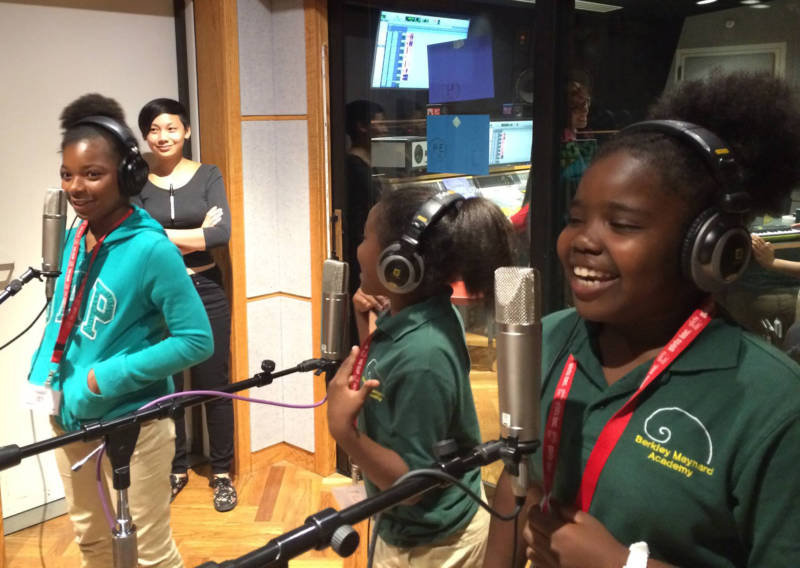 Students try out vocal mics during a class at WAM