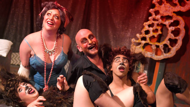 (L to R) Madame Banga (Zelda Koznofski) and Tozzini (David Bicha) share some time with their dog children (Alix Feinsod and Earl Alfred Paus) in the Thrillpeddlers' production of 'Pyramid of Freaks' by Rob Keefe.