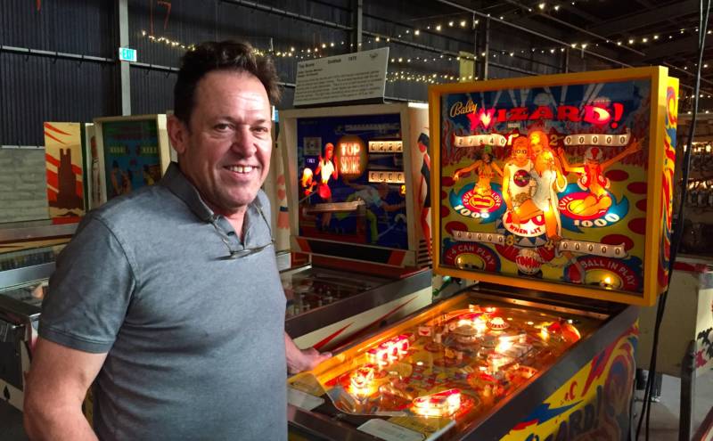 Pinball Museum Director Michael Schiesse about to play a few rounds on Wizard, a pinball game that will be auctioned off this weekend at the Pinball Museum's Shoot the Moon Expo in Alameda
