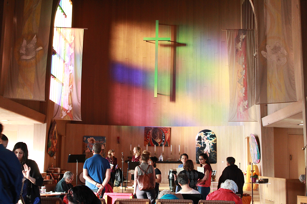 A rainbow reflects into the herchurch building after Yolanda Lopez's talk.