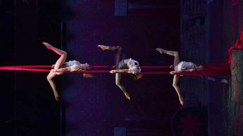(L to R) TT Robson, Julie Rogers, and Lillian Ferreira hang in unison in Kinetic Art's 'Inversion' directed and conceived by Jaron Hollander.