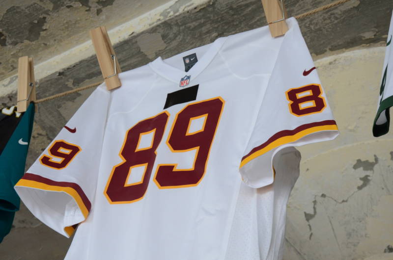 Black duct tape covers up the term "Redskins" on a football jersey at the art installation "Shortening: Making the Irrational Rational" on Tuesday, November 15, 2016. The artist says he used the duct tape to mute what he views as a derogatory term towards Native Americans.
