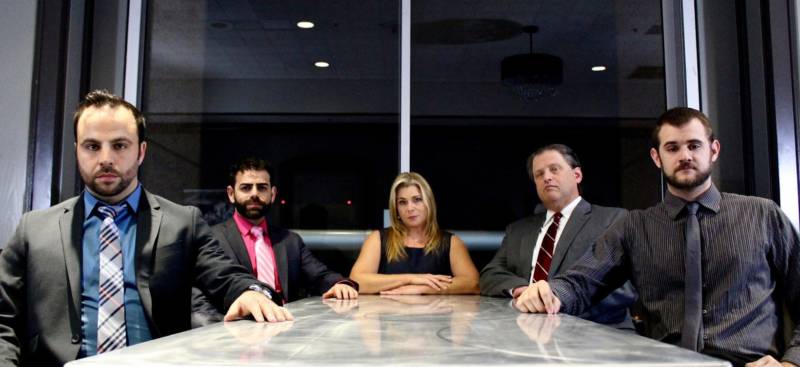 Corporate consultants with a creepy agenda: Pictured, from left: Brock (George Psarras), Sandeep (Sunny Moza), Hannah (Lisa Mallette), Ted (Tom Gough) and Scooter (Max Tachis)