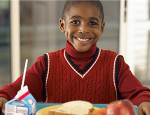 child eating school lunch