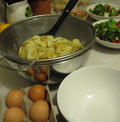 Drain the potatoes and onions in a fine-mesh sieve set over a bowl