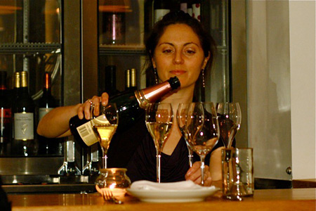 Elan Drucker pours wine