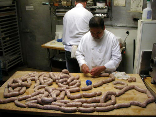  Oliveto butcher Pablo Tigre Mendoza Gavito prepares sausage in the back kitchen.