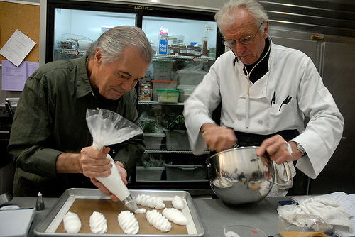 Jacques Pepin and Jean-Claude Szurdak make pastries in the back kitchen at KQED during the taping of Essential Pepin.