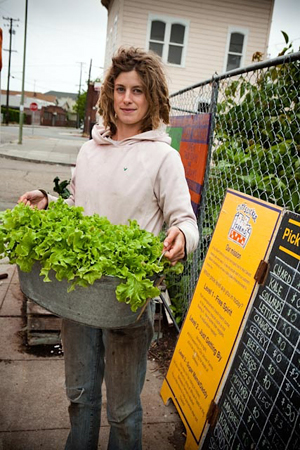 Adelle Martin readies the lettuce for the City Slicker sliding scale market table