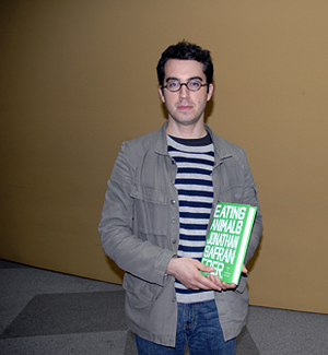 Jonathan Safran Foer at KQED holding his  book, Eating Animals. Photo by Wendy Goodfriend